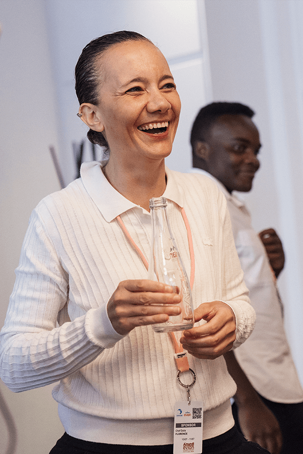 Chef Florence Dalia with a bottle of Evian Sparkle.