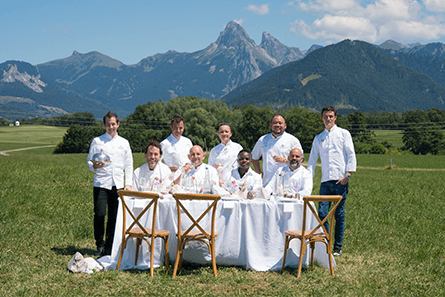 Chef Community in front of mountain panorama.