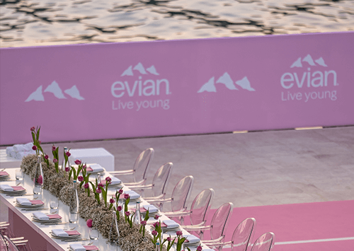 Set table at an evian® Sport and Fashion Event near the water.
